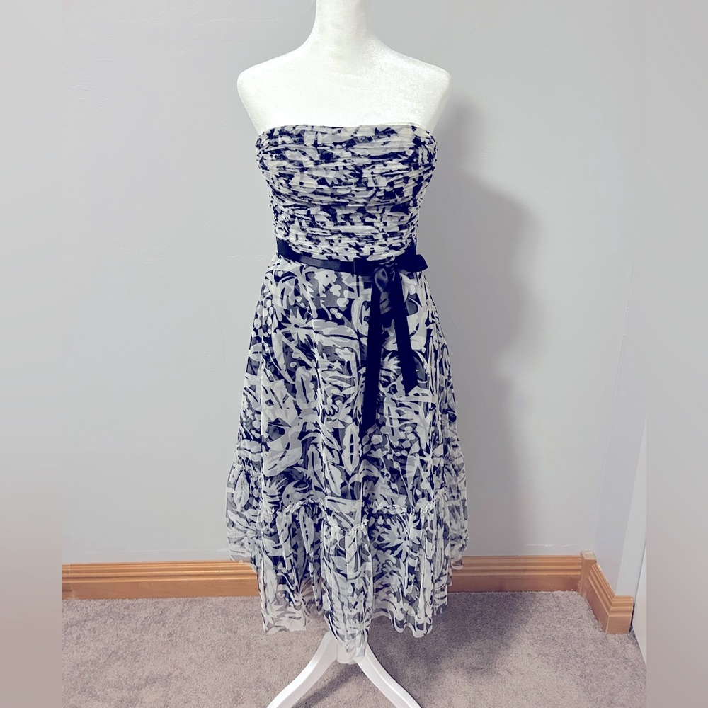 BCBG MazAzria strapless cocktail dress with sequin detail.